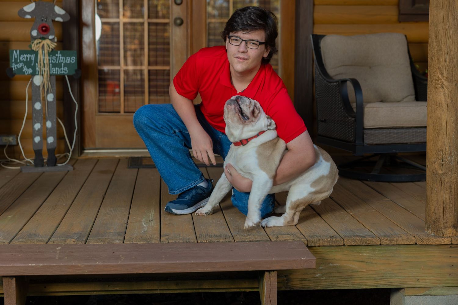 Senior portrait with his dog photographed by Joey Rhodes Photography